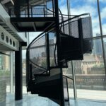 Spiral staircase with expanded metal balustrade